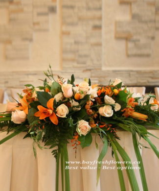 Wedding flowers and centerpieces in cream-orange colors