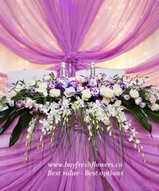 Wedding flowers and centerpieces in cream-purple colors