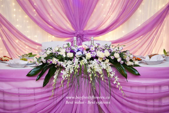 Wedding flowers and centerpieces in cream-purple colors